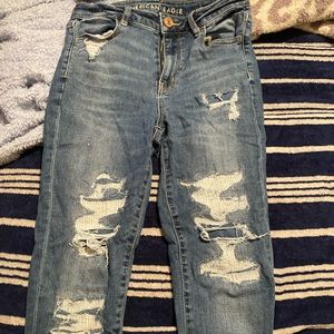 American Eagle ripped jeans. Next Level Stretch.